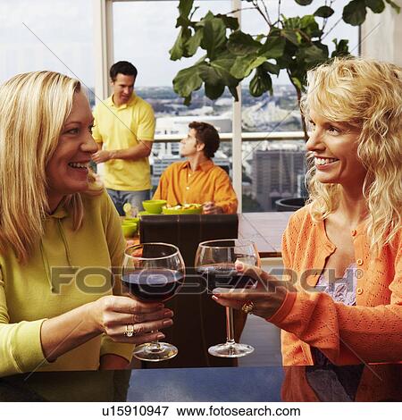 Mature woman with a mid adult woman toasting a drink View Large Photo Image Stock Photo - Mature woman with a mid adult woman toasting a drink. Fotosearch