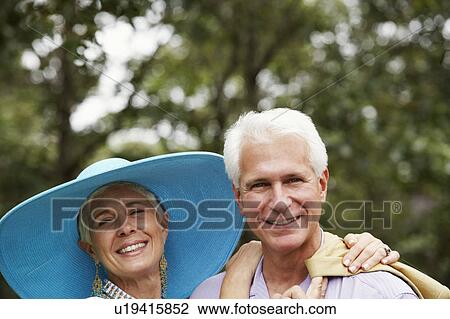 Stock Image - Portrait of a mature man and a senior woman smiling. Fotosearch