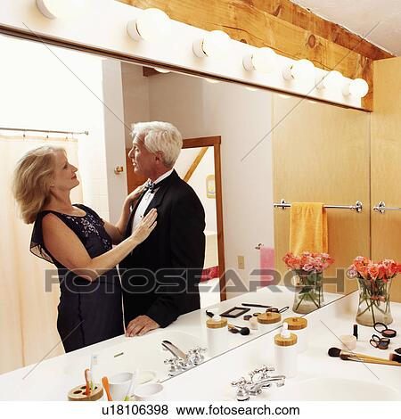 Reflection of a mature couple looking at each other on a mirror View Large Photo Image Stock Photo - Reflection of a mature couple looking at each other on a mirror. Fotosearch