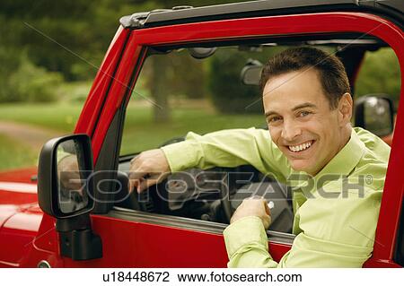 Portrait of a mature man in a driver seat of a car and smiling View Large Photo Image Stock Image - Portrait of a mature man in a driver seat of a car and smiling. Fotosearch