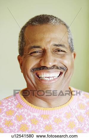 Portrait of a mature man smiling View Large Photo Image Stock Image - Portrait of a mature man smiling. Fotosearch