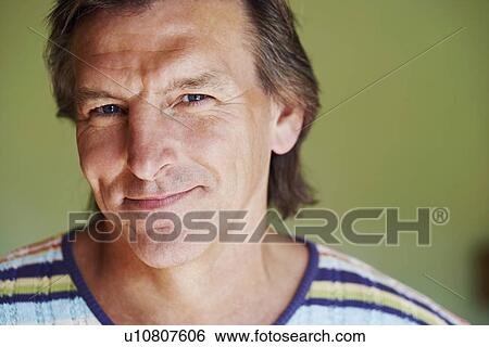 Portrait of a mature man smiling View Large Photo Image Stock Photograph - Portrait of a mature man smiling. Fotosearch