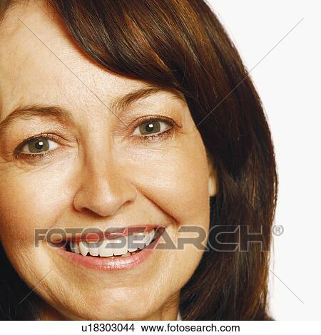 Portrait of a mature woman smiling View Large Photo Image Picture - Portrait of a mature woman smiling. Fotosearch