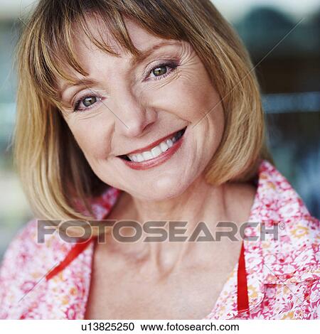 Stock Image - Portrait of a mature woman smiling. Fotosearch