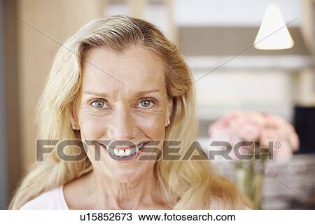 Stock Image - Portrait of a mature woman smiling. Fotosearch