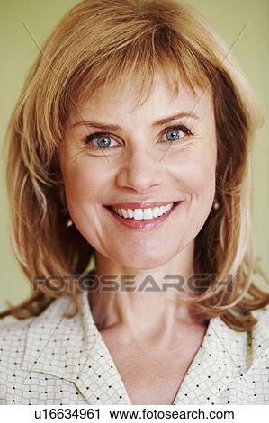Portrait of a mature woman smiling View Large Photo Image Stock Image - Portrait of a mature woman smiling. Fotosearch