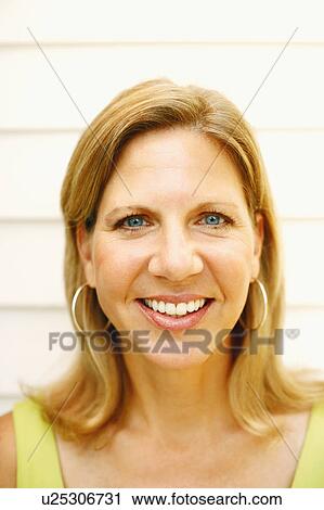 Stock Image - Portrait of a mature woman smiling. Fotosearch