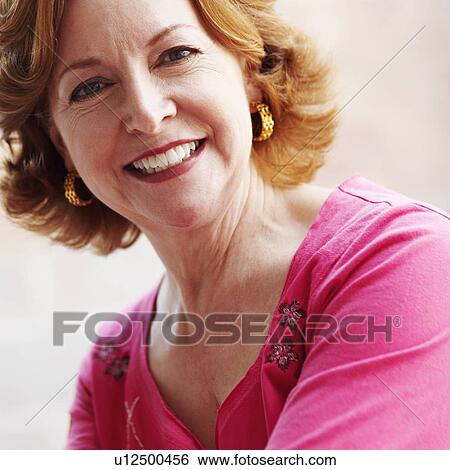Stock Photograph - Portrait of a mature woman smiling. Fotosearch