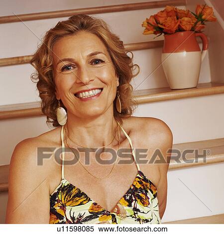 Stock Photography - Portrait of a mature woman smiling. Fotosearch