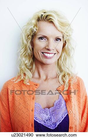 Stock Image - Portrait of a mid adult woman smiling. Fotosearch