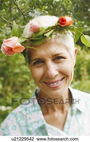 Stock Image - Portrait of a senior woman smiling. Fotosearch