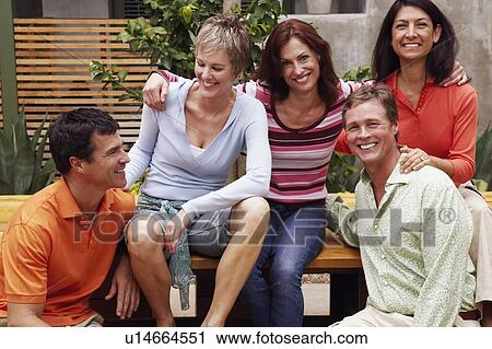 Close-up of two mature men and three mature women sitting together View Large Photo Image Stock Image - Close-up of two mature men and three mature women sitting together. Fotosearch