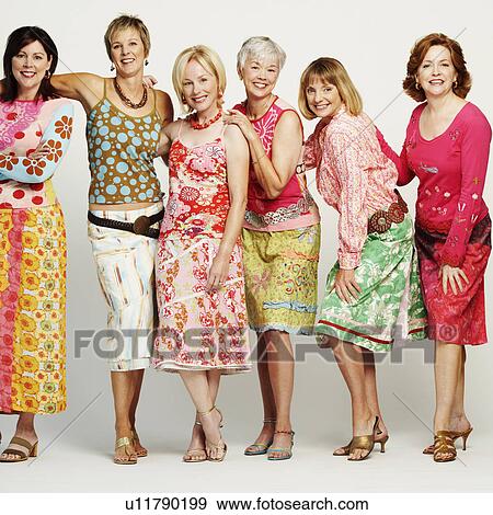 Stock Photo - Portrait of a group of mature women standing and smiling. Fotosearch