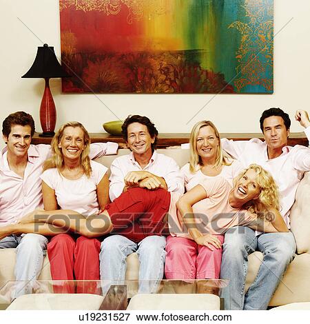 Portrait of a group of people sitting together on a couch View Large Photo Image Stock Photo - Portrait of a group of people sitting together on a couch. Fotosearch