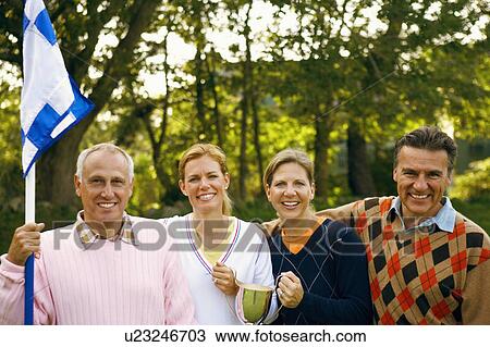 Stock Image - Portrait of two couples smiling. Fotosearch