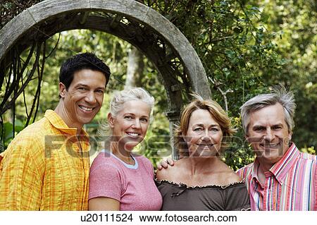 Picture - Portrait of two mature couples smiling. Fotosearch