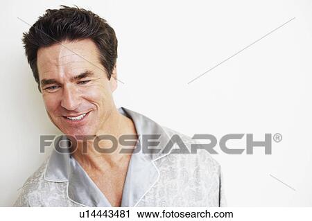 Close-up of a mature man smiling View Large Photo Image Stock Image - Close-up of a mature man smiling. Fotosearch