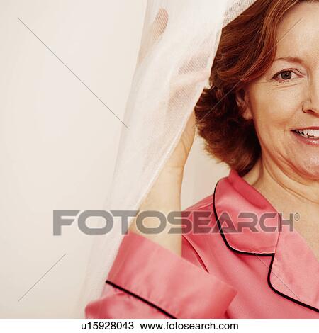 Stock Image - Portrait of a mature woman smiling. Fotosearch