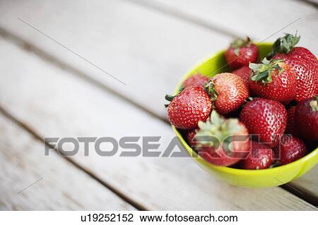Close-up of strawberries in a bowl View Large Photo Image Stock Image - Close-up of strawberries in a bowl. Fotosearch