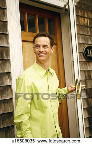Close-up of a mature man holding a door handle and smiling View Large Photo Image Stock Photography - Close-up of a mature man holding a door handle and smiling. Fotosearch