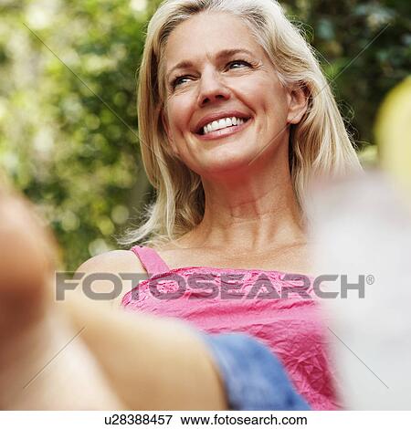 Stock Photo - Close-up of a mature woman smiling. Fotosearch
