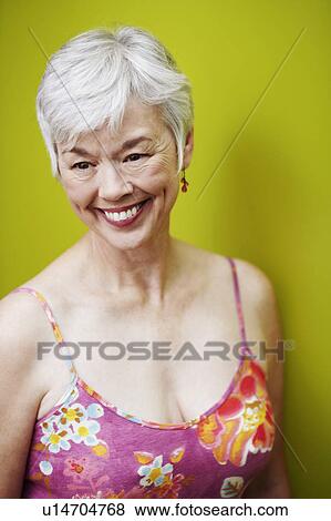 Close-up of a senior woman smiling View Large Photo Image Stock Photo - Close-up of a senior woman smiling. Fotosearch