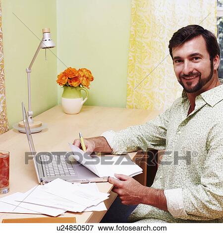 Portrait of a mature man smiling and holding a document View Large Photo Image Stock Photo - Portrait of a mature man smiling and holding a document. Fotosearch