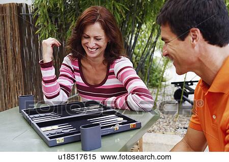 Mature couple playing backgammon View Large Photo Image Stock Photography - Mature couple playing backgammon. Fotosearch