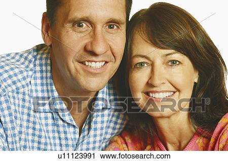 Stock Image - Portrait of a mature couple smiling. Fotosearch
