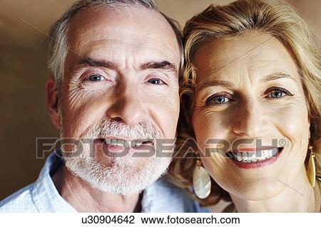 Stock Image - Portrait of a mature couple smiling. Fotosearch