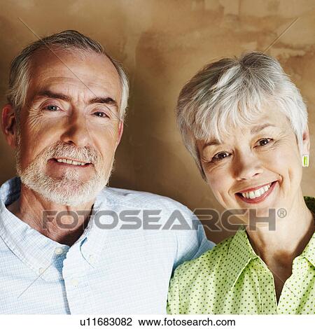 Stock Image - Portrait of a mature man and a senior woman smiling. Fotosearch