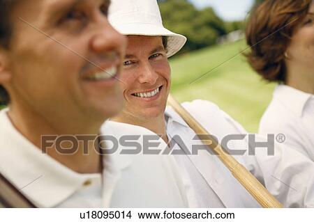 Portrait of a mid adult man smiling with a mature man beside him View Large Photo Image Picture - Portrait of a mid adult man smiling with a mature man beside him. Fotosearch