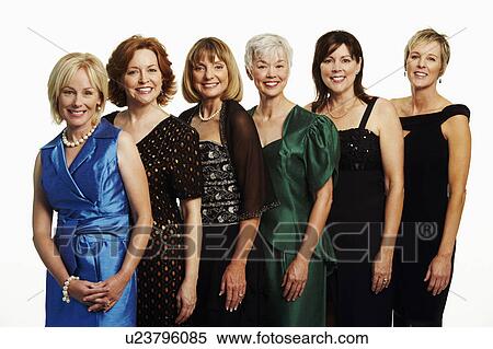 Stock Photography - Portrait of a group of mature women standing together and smiling. Fotosearch