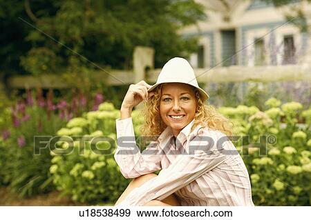 Stock Photo - Portrait of a mature woman smiling. Fotosearch