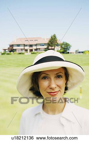 Portrait of a mid adult woman smiling View Large Photo Image Stock Photograph - Portrait of a mid adult woman smiling. Fotosearch