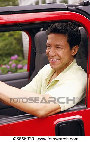 Close-up of a mature man sitting in a sports utility vehicle and smiling View Large Photo Image Stock Image - Close-up of a mature man sitting in a sports utility vehicle and smiling. Fotosearch