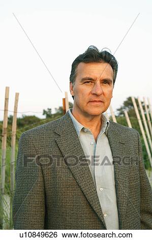 Stock Photograph - Portrait of a mature man looking serious. Fotosearch