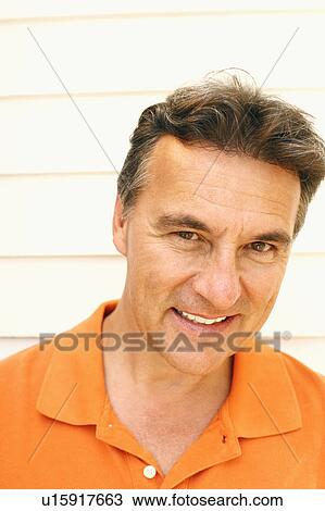 Portrait of a mature man smiling View Large Photo Image Stock Image - Portrait of a mature man smiling. Fotosearch