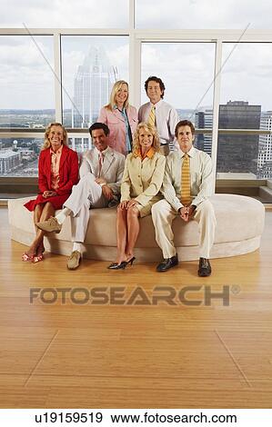 Portrait of three businessmen and three businesswomen smiling View Large Photo Image Stock Photo - Portrait of three businessmen and three businesswomen smiling. Fotosearch
