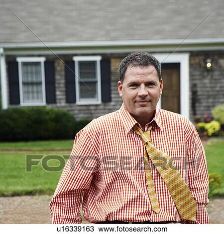 Portrait of a businessman smiling View Large Photo Image Stock Image - Portrait of a businessman smiling. Fotosearch