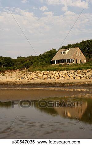 Stock Photography - Reflection of a house on water. Fotosearch