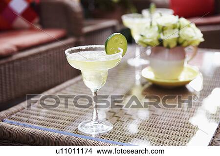 Close-up of a glass of lemonade on a table View Large Photo Image Picture - Close-up of a glass of lemonade on a table. Fotosearch