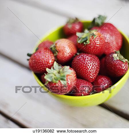 Stock Image - Close-up of strawberries in a bowl. Fotosearch