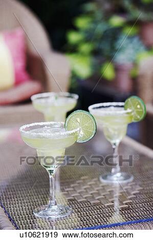 Close-up of three glasses of lemonade View Large Photo Image Stock Photo - Close-up of three glasses of lemonade. Fotosearch