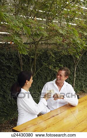 High angle view of a mature couple toasting with flutes of champagne View Large Photo Image Stock Image - High angle view of a mature couple toasting with flutes of champagne. Fotosearch