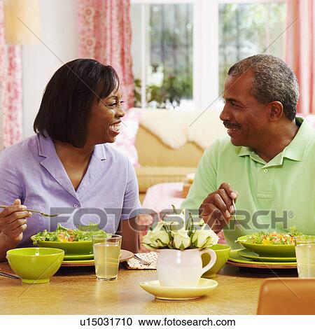 Mature couple eating salad and looking at each other View Large Photo Image Stock Image - Mature couple eating salad and looking at each other. Fotosearch