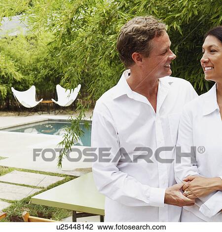 Mature couple looking at each other and smiling View Large Photo Image Stock Image - Mature couple looking at each other and smiling. Fotosearch
