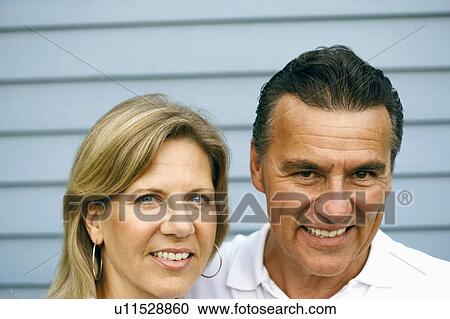 Stock Image - Portrait of a mature couple smiling. Fotosearch