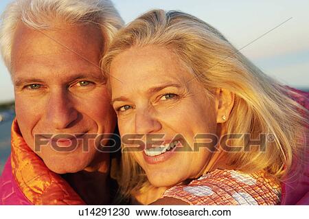 Portrait of a mature couple smiling View Large Photo Image Stock Image - Portrait of a mature couple smiling. Fotosearch