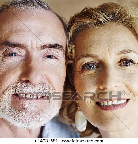 Stock Image - Portrait of a mature couple smiling. Fotosearch